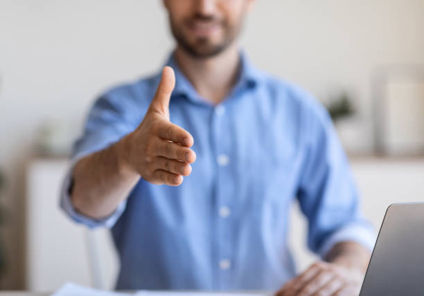 istock Partnership Concept. Businessman Stretching Hand For Handshake Greeting During Job Interview Sitting In Modern Office. Selective Focus 1270394084