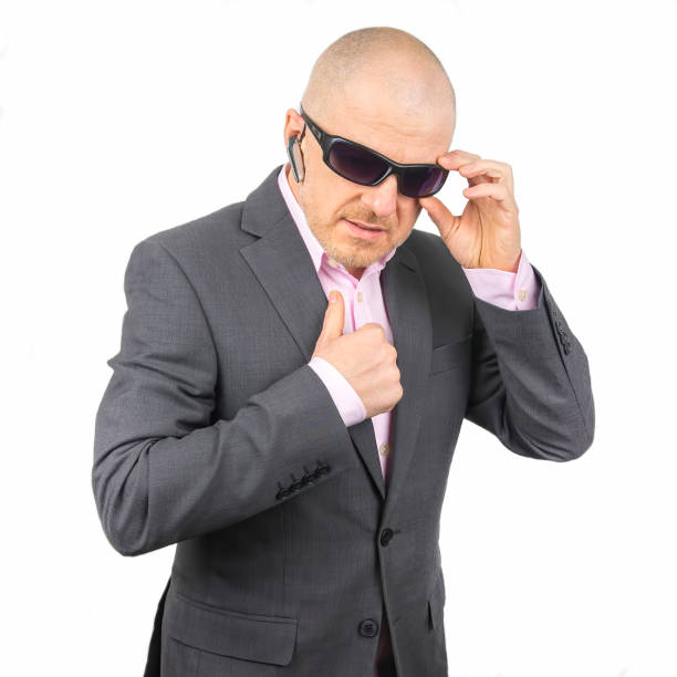 istock business man in a jacket with safety glasses on a light background 1270394914
