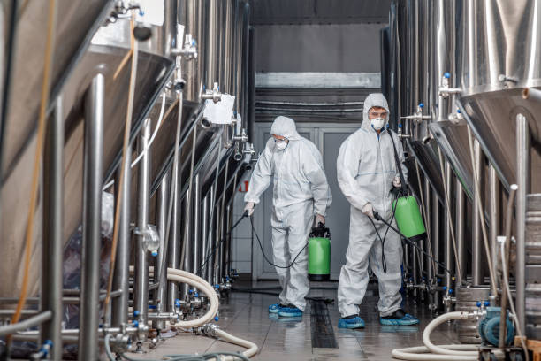 istock Worker in hazmat suit making disinfection inside beer plant 1270395234
