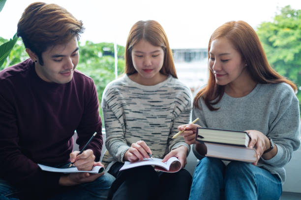 istock young students tutoring and  catching up workbook with friends 1270395940