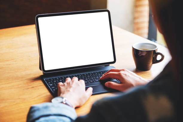 istock a woman using and typing on digital tablet keyboard with blank white desktop screen as a computer pc 1270395944