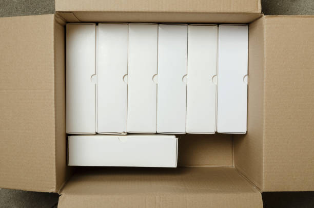 Top view of opened box and several parsels with labels in it