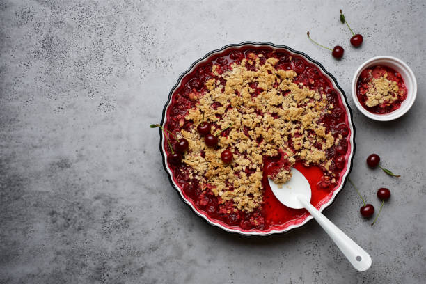 istock Cherry crumble with oatmeal crust in baking dish.  Gray background, top view 1270396207