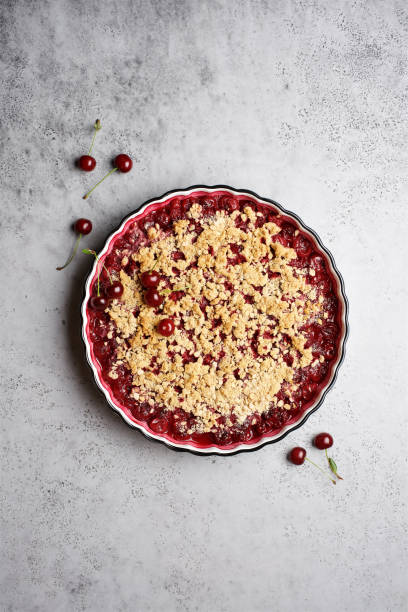 istock Cherry crumble with oatmeal crust in baking dish.  Gray background, top view 1270396747
