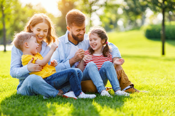 Happy family resting on lawn together