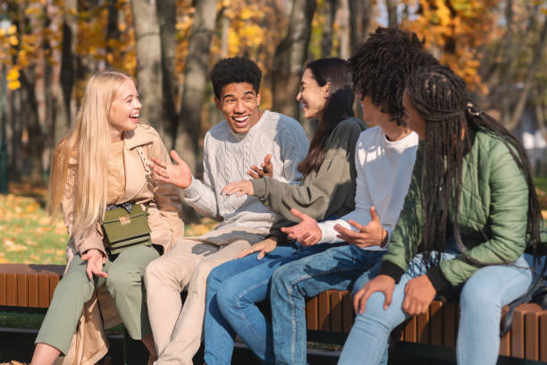 istock Black cheerful guy telling friends funny story 1270399387
