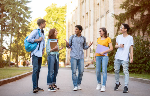 istock Group Of Mixed Students Walking Together Talking During Break Outside 1270400822