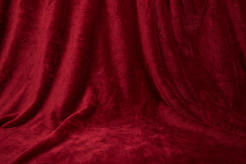 Velvet red drapped curtain cloth full frame