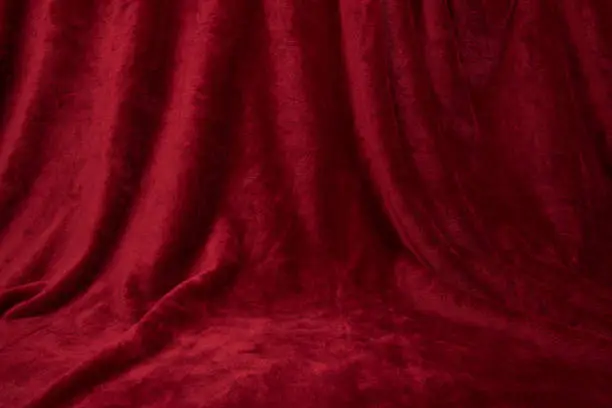 Photo of Velvet red drapped curtain cloth full frame