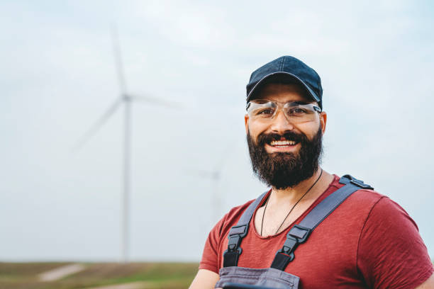 istock Young maintenance engineer man working in wind turbine farm 1270401953