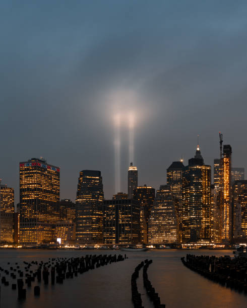 9/11 Mermorial in New York City, United States A view on the two lights in remembrance of 9/11 and the twin towers. to the struggle against world terrorism statue photos stock pictures, royalty-free photos & images