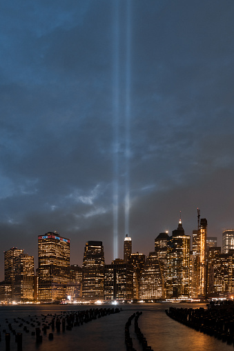 Tribute in Light. The two vertical columns of light rising between the skyscrapers in Lower Manhattan. New York City
