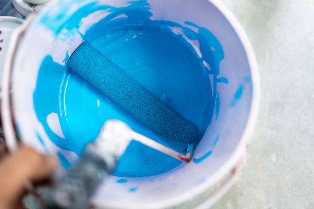 istock Blue color paint bucket with paint roller. 1270405161