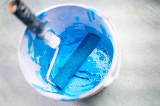 istock Blue color paint bucket with paint roller. 1270405175