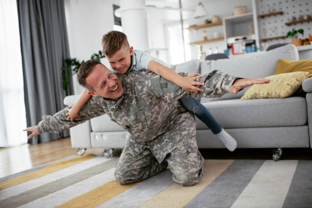 istock Soldier having fun with his son at home 1270410017