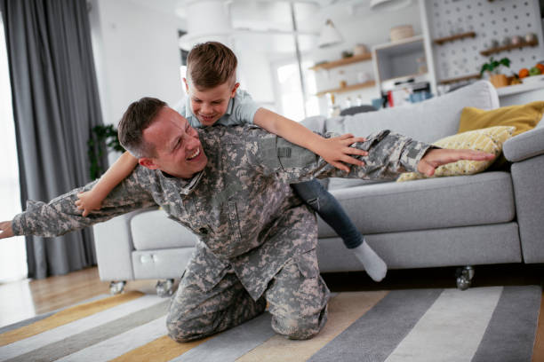 istock Soldier having fun with his son at home 1270410020