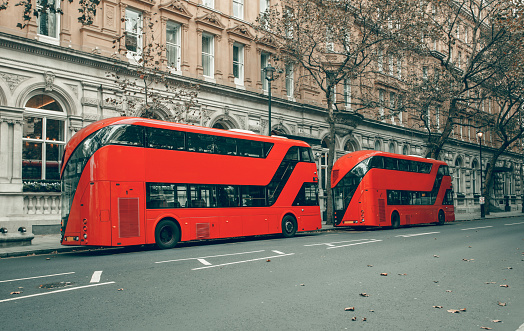 Famous red busses in stationary. London public transport.