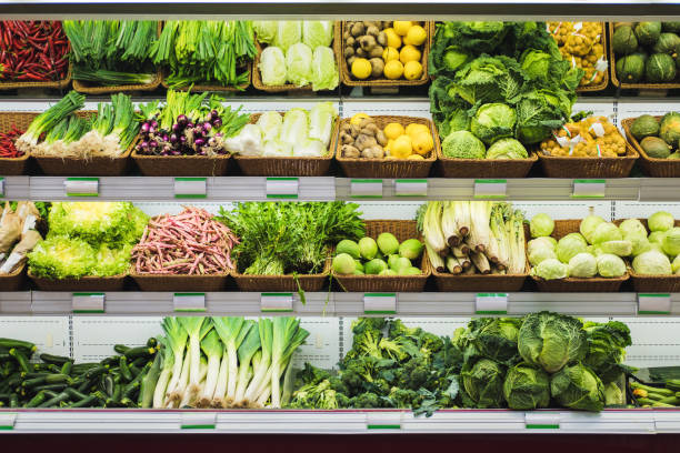 istock Fresh vegetables on supermarket shelves with empty price tags. 1270411477