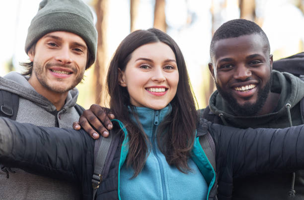 istock Three international friends taking selfie over forest background 1270413730