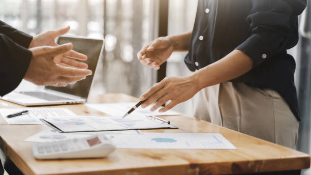 istock Business executives cooperation in sale data performance report. 1270414140