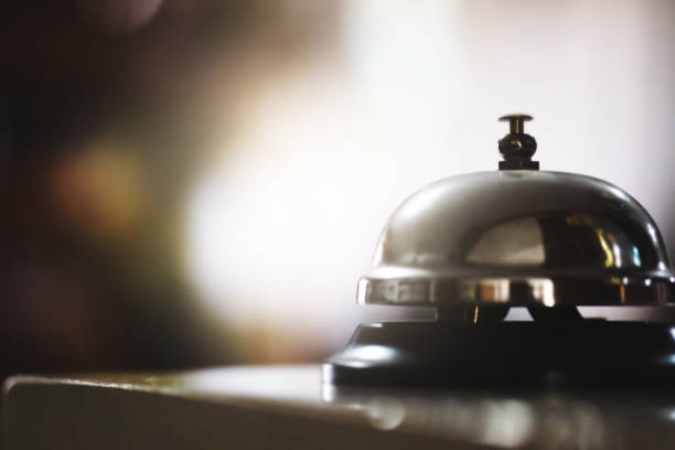 Hotel reception service bell on the table, Selective focus. Hotel reception service bell on the table, Selective focus. porter photos stock pictures, royalty-free photos & images