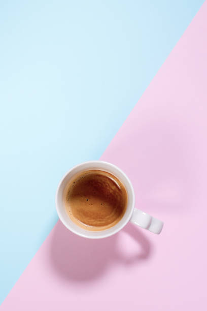 istock Fresh one cup espresso coffee with milk on pastel 1270415388