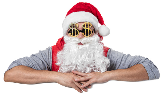 Man with Santa cap and white beard leaning over billboard banner. The man is wearing golden dollar shaped sunglasses. Isolated on white. You can add extra white space with your message to the bottom.