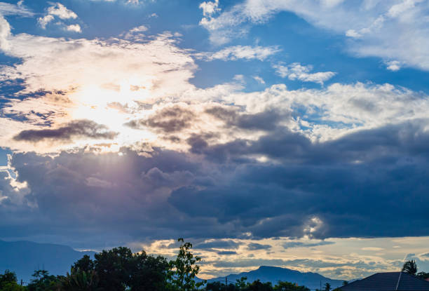 istock beautiful sunlight rays sine through clouds in blue sky, natural background 1270415909