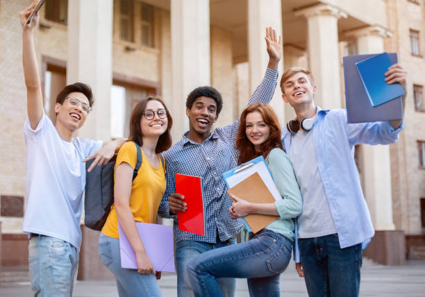 istock Happy First-Year Students Posing Standing Outside, Excited About Entering University 1270416713