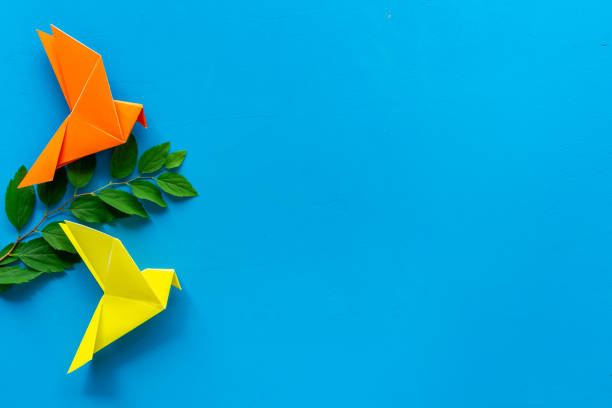 istock Colored origami - paper birds with leaves, overhead view 1270418527