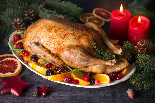istock Whole roasted duck with oranges, berries and herbs 1270419667