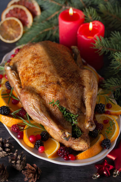 istock Whole roasted duck with oranges, berries and herbs 1270419727