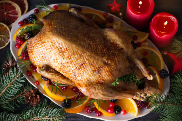 istock Whole roasted duck with oranges, berries and herbs 1270419758