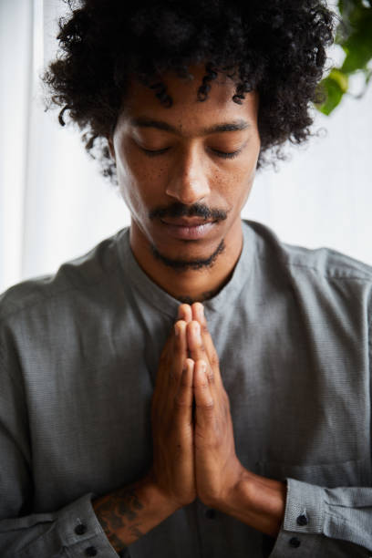 istock Young man with his hands together during a meditation 1270421910
