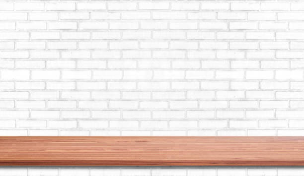 istock Empty wood plank shelf at white brick wall pattern background. Design for product display, mockup, advertise, banner, or montage 1270423238