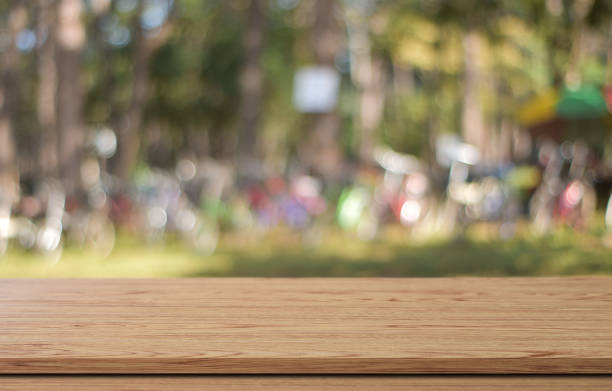 istock Empty wood table or shelf surface over blur green bokeh light background, for product display banner, mock up. 1270423784