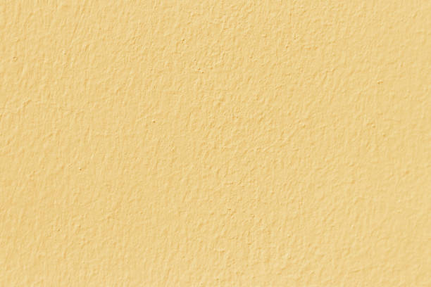 istock Decorative wall with beautiful stone in yellow cement wall. 1270425701