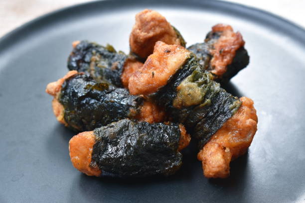 istock fried salty chicken roll seaweed on plate 1270428788