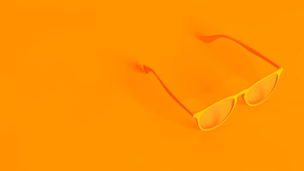 istock Concept stereoscopic image. Eyeglasses isolated on orange background. 1270429760