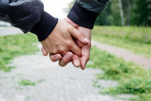 istock woman with a man holding a hand 1270431580