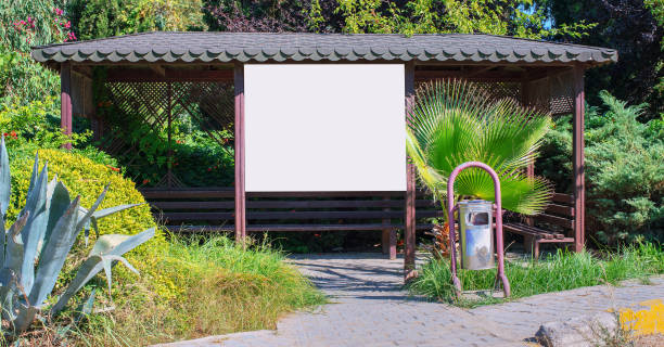 istock wooden shelter or bus stop with empty signage with mockup place 1270433809