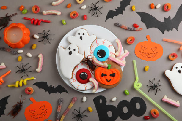istock Halloween background with gingerbread and other sweets top view with place for text 1270433986