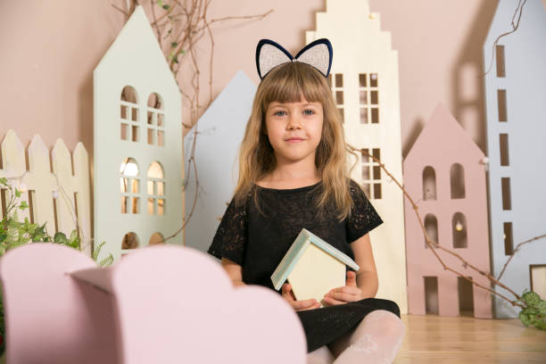 istock Little beautiful girl with cat ears. Copy space. 1270434637