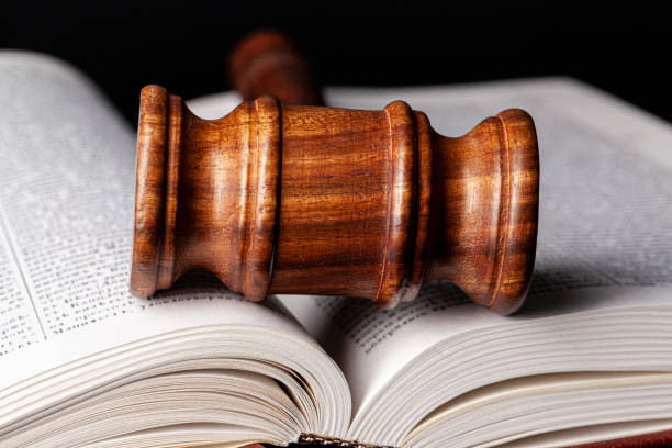 istock Wooden gavel and juridical books close up 1270435321