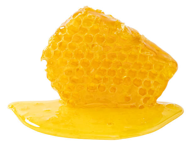 istock Honeycomb piece. Honey slice isolated on white background 1270435789