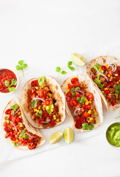 istock mexican beef and pork tacos with salsa, guacamole and vegetables 1270436112