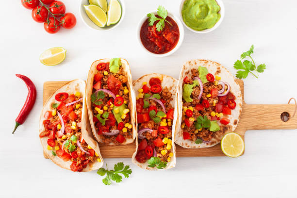 istock mexican beef and pork tacos with salsa, guacamole and vegetables 1270436133
