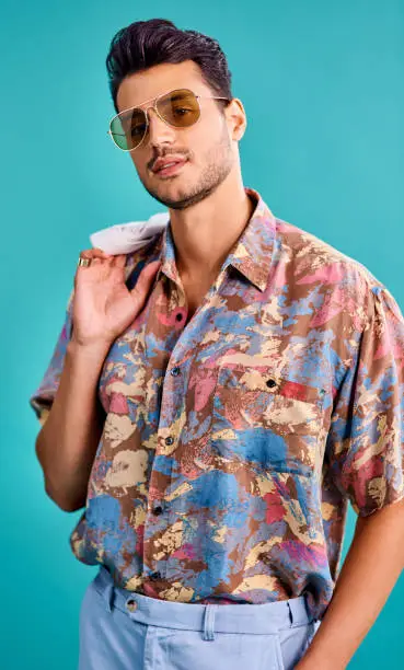 Cropped shot of a handsome young man styled in 80s fashion