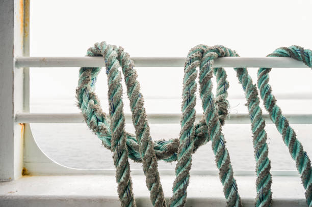 istock Light Blue Ropes Wrapped Around Ferry Boat Railing 1270443326