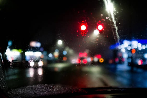 istock Rainy Windshield with Traffic and City Lights in Background at Night 1270443378